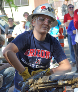 Allison Hagerman is determined to make a good showing here at her last UA jackleg drilling competition in April. Hagerman intends to carry that resolve, along with an abiding respect for safety and an appreciation for those who came before her, into her mining engineering career. "It’s important to always remember that the older folks are there to teach you. I learn something new every day," said the new graduate and captain of the UA women's mine rescue team. (Photo by Patrick McArdle/UANews) Allison Hagerman is determined to make a good showing here at her last UA jackleg drilling competition in April. Hagerman intends to carry that resolve, along with an abiding respect for safety and an appreciation for those who came before her, into her mining engineering career. "It’s important to always remember that the older folks are there to teach you. I learn something new every day," said the new graduate and captain of the UA women's mine rescue team. (Photo by Patrick McArdle/UANews)